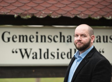 Stefan Jagsch (NPD), local leader of Altenstadt-Waldsiedlung, stands in front of the community house in the district in which he was elected.