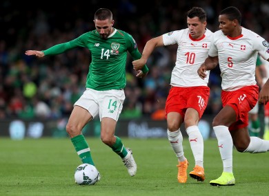 Ireland's Conor Hourihane under pressure from Granit Xhaka and Manuel Akanji of Switzerland.