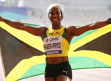Shelly-Ann Fraser-Pryce celebrates her gold medal