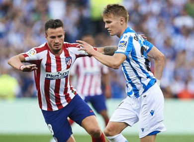 Martin Odegaard takes on Saul Niguez during Real Sociedad's win over Atletico Madrid.