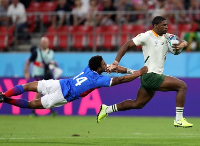Full flow: Namibia's Chad Plato tackles South Africa's Warrick Gelant.