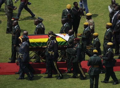 Mugabe's coffin arrives for a state funeral for at the National Sports Stadium in Harare.