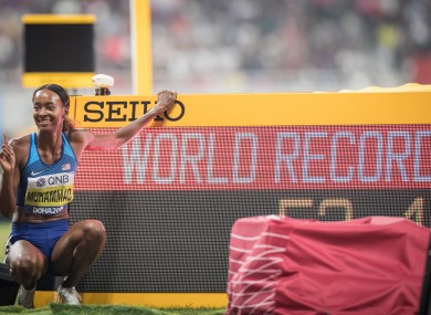Dalilah Muhammad celebrates winning the women's 400 Metres Hurdles event and setting a new world record.