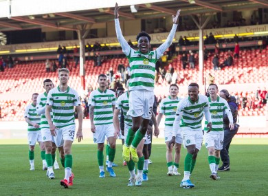 Jeremie Frimpong celebrates with his team-mates in front of the Celtic fans.