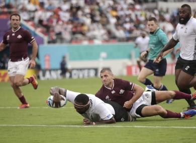 Fiji's Api Ratuniyarawa reaches out to score try during the Pool D game.