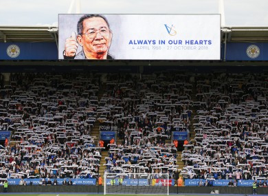 Fans observe a minute's silence in memory of former Leicester City chairman Vichai Srivaddhanaprabha.