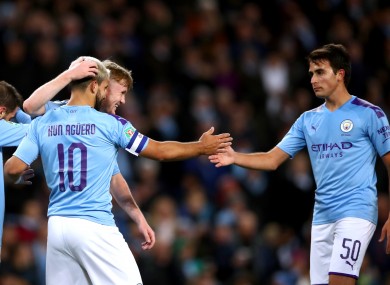 Sergio Aguero is congratulated by team-mates after his second goal.