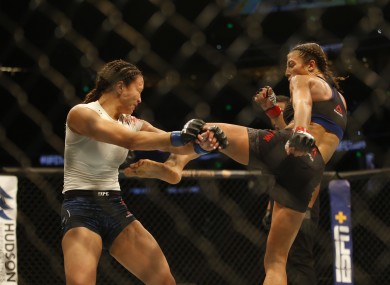 Jedrzejczyk aims a kick at Waterson during their top-billed bout in Tampa.