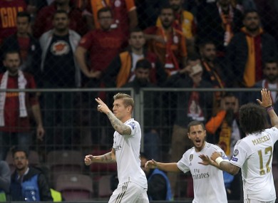 Real Madrid's Toni Kroos, left, celebrates with teammates.