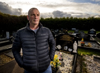 Michael McConville, son of IRA murder victim Jean McConville, at her grave.