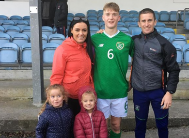 Cathal pictured with his parents and sisters.