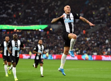 Jonjo Shelvey celebrates his late strike.