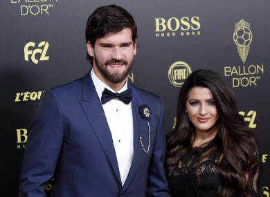 Liverpool's goalkeeper Alisson Becker poses with his wife Natalia Loewe during the Golden Ball award ceremony.