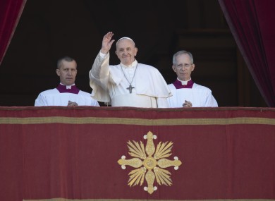 Pope Francis waves to faithful and pilgrims after he delivered the Urbi et Orbi