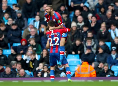 Crystal Palace's Cenk Tosun celebrates scoring his side's first goal with James McCarthy.
