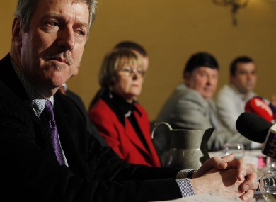 File photo. Survivor Steve Travers with family members at a press conference.