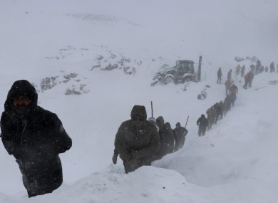 A huge team of rescue workers had been sent to find people missing in an earlier avalanche.