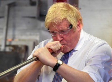 Johnson pictured blowing glass prior to chairing a cabinet meeting at National Glass Centre at the University of Sunderland.