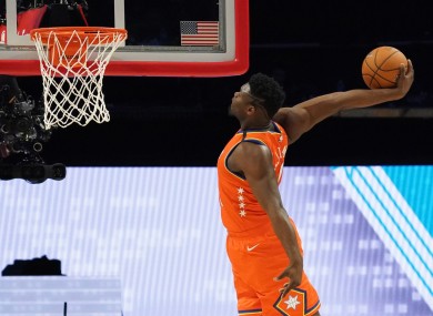 Zion Williamson getting a basket in the NBA Rising Stars basketball game.
