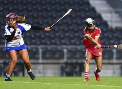 Saoirse McCarthy shoots past Iona Heffernan for Cork's goal.