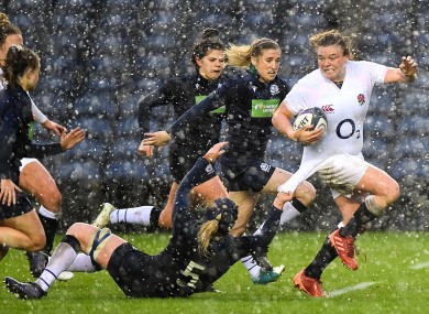 England's Sarah Bern is tackled by Sarah Bonar of Scotland.