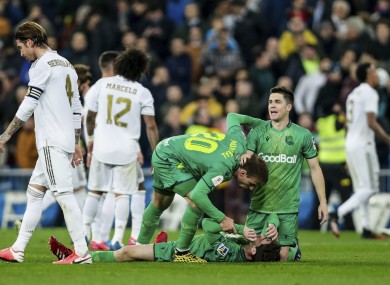 Real Sociedad players, centre, celebrate their victory against Real Madrid.