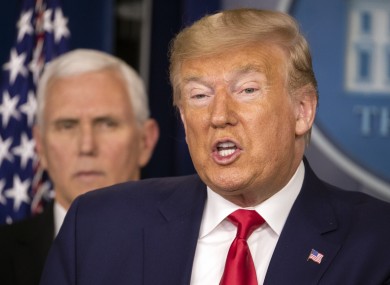 The US President flanked by Vice President Mike Pence at a press conference this evening.