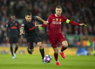 Liverpool captain Jordan Henderson and Atletico Madrid's Angel Correa.