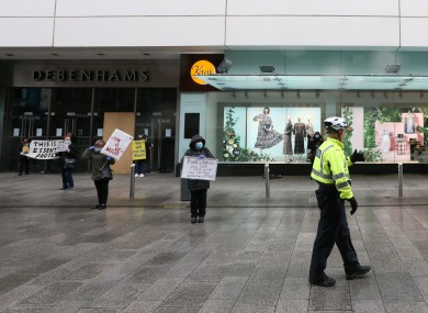 Pictured are Gardai on the scene as workers protest outside the Henry Street branch of Debenhams yesterday.
