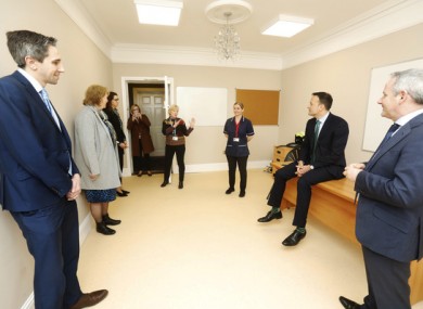 Taoiseach Leo Varadkar, Minister for Health Simon Harris and Paul Reid CEO of the HSE in one of the clinic rooms in the Citywest Hotel today.