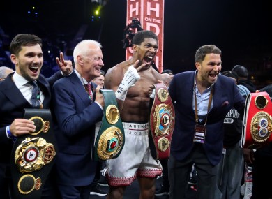 Barry Hearn (second left) alongside Anthony Joshua (centre) and Eddie Hearn (right).