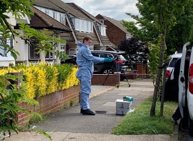 A police forensic officer at the scene in Kerry Drive, Upminster, East London
