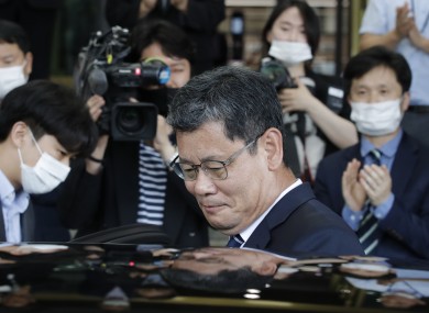 South Korea's unification minister Kim Yeon-chul gets into a car as he leaves the government complex in Seoul today.