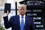 Trump holds a Bible as he visits outside St. John's Church, which was set on fire during protests on Sunday night, across Lafayette Park from the White House.