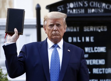 Trump holds a Bible as he visits outside St. John's Church, which was set on fire during protests on Sunday night, across Lafayette Park from the White House.