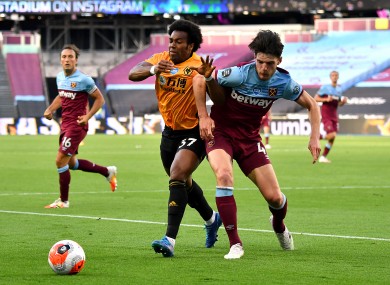 Adama Traore wins a challenge with Declan Rice.
