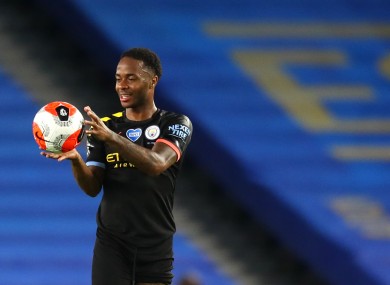 Raheem Sterling collects the match ball.