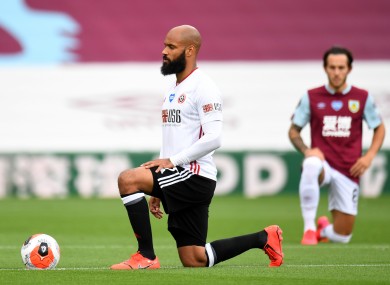 Sheffield United and Ireland's David McGoldrick takes a knee in a protest against racism during a Premier League match with Burnley.
