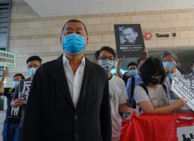Hong Kong media tycoon Jimmy Lai, founder of the Apple Daily local newspaper, arrives at court.