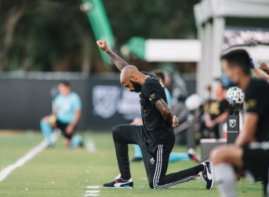 Thierry Henry taking a knee.