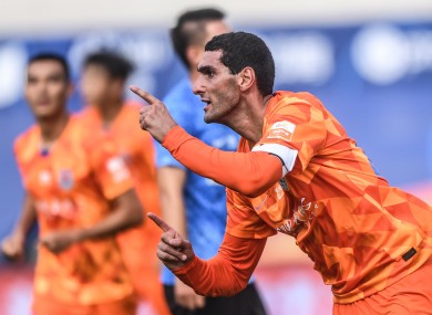 Marouane Fellaini of Shandong Luneng celebrates after scoring a goal.