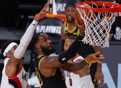 LeBron James (23) shoots against Portland Trail Blazers' Carmelo Anthony.