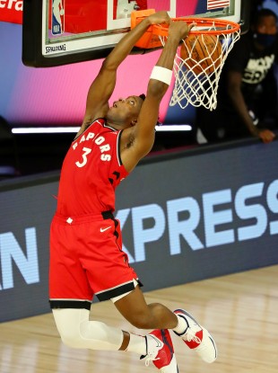Toronto Raptors forward OG Anunoby makes a reverse dunk against the Brooklyn Nets.