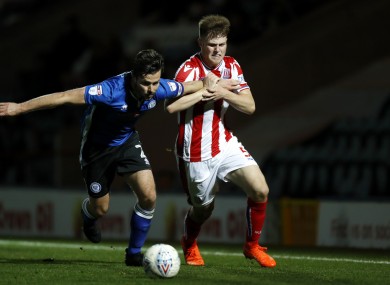 Cameron McJannet (right) tangling with Joe Rafferty during a Checkatrade Trophy game between Stoke City and Rochdale.