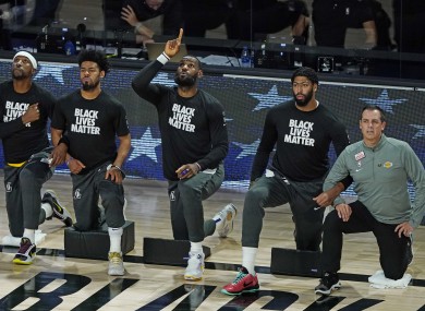 Players taking a knee before the game.