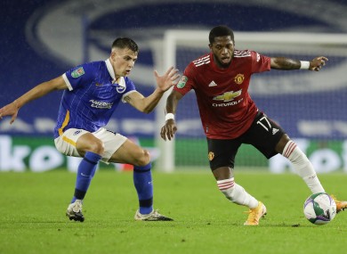 Jayson Molumby of Brighton & Hove Albion keeping tabs on Manchester United's Fred.