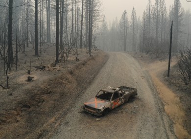 A burned out truck sits on Graystone Lane after the Bear Fire near Lake Oroville in Northern California