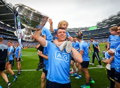 Darren Daly celebrates with his son Odhrán after Dublin's win against Tyrone in the 2018 All-Ireland final.