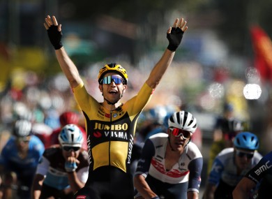 Wout van Aert celebrates as he crosses the finish line.