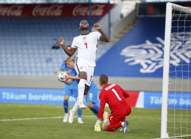 England's Raheem Sterling celebrates after scoring the opening goal from the penalty spot.